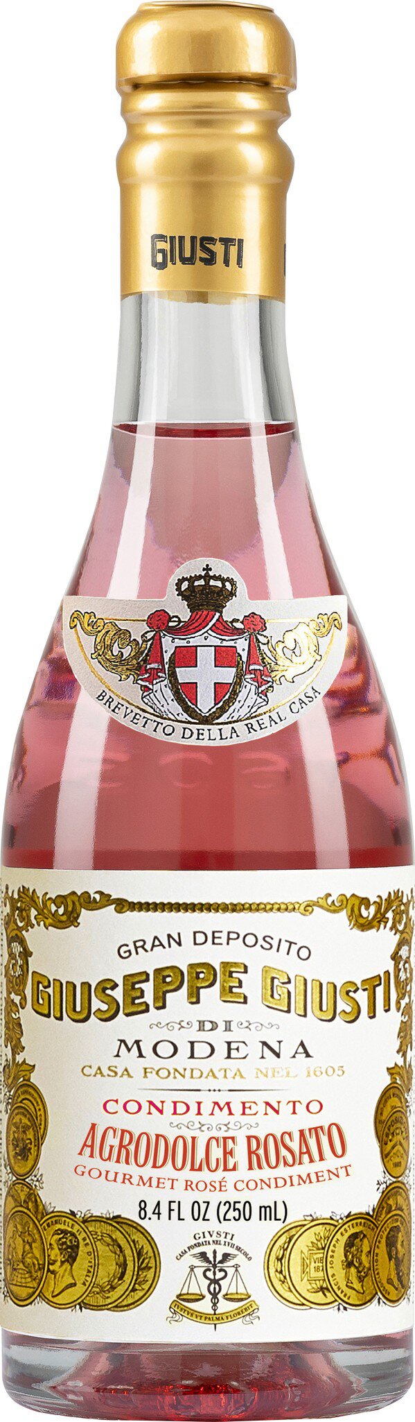 Eine Flasche Rosé-Sekt mit einer eleganten goldenen Kapsel und einem dekorativen Etikett. Die Flasche steht auf einem neutralen Hintergrund, betont durch ihre edle Ausstrahlung.